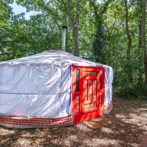 Love yurt in the middle of a wooded area.